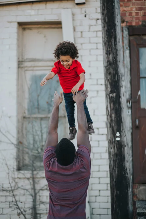 Dad playing with son